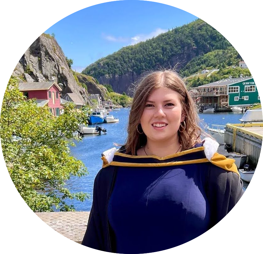 a convocation photo of Sarah Stone with Quidi Vidi lake in the background